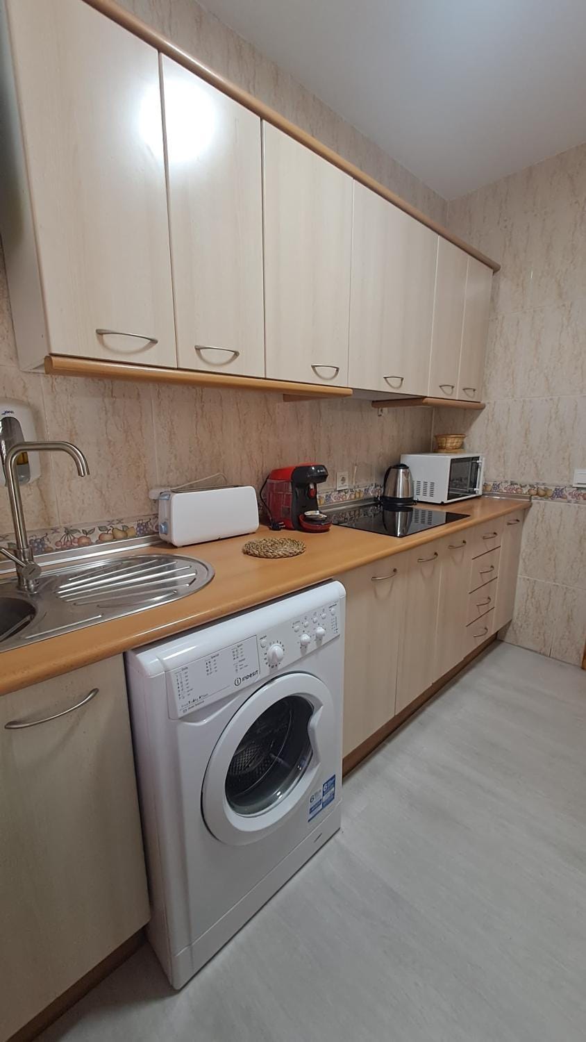 Kitchen or kitchenette, washing machine