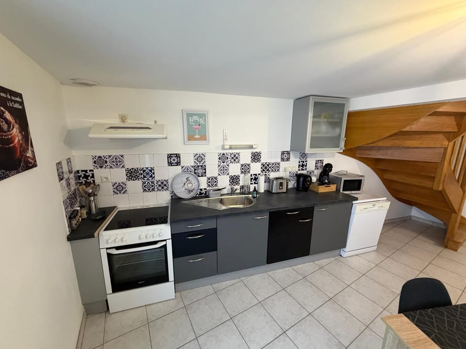 Kitchen or kitchenette, dishwasher, oven, stove, toaster