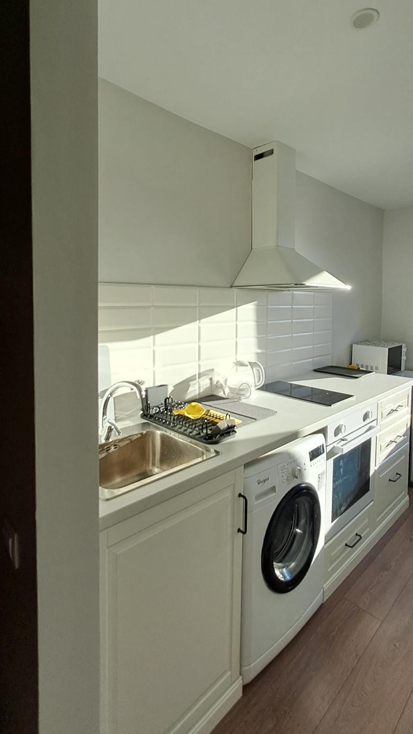 Kitchen or kitchenette, stove, washing machine