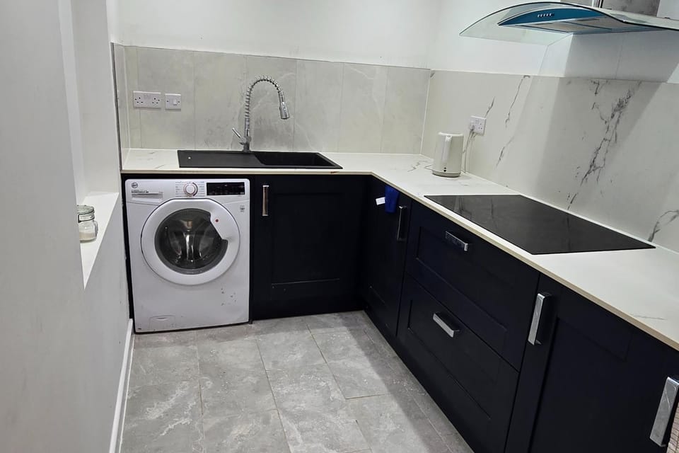 Kitchen or kitchenette, furniture, stove, washing machine