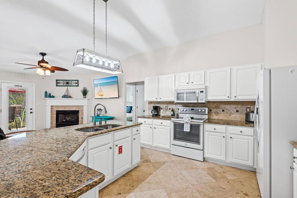 Kitchen or kitchenette, Living room, fireplace, furniture, microwave, oven
