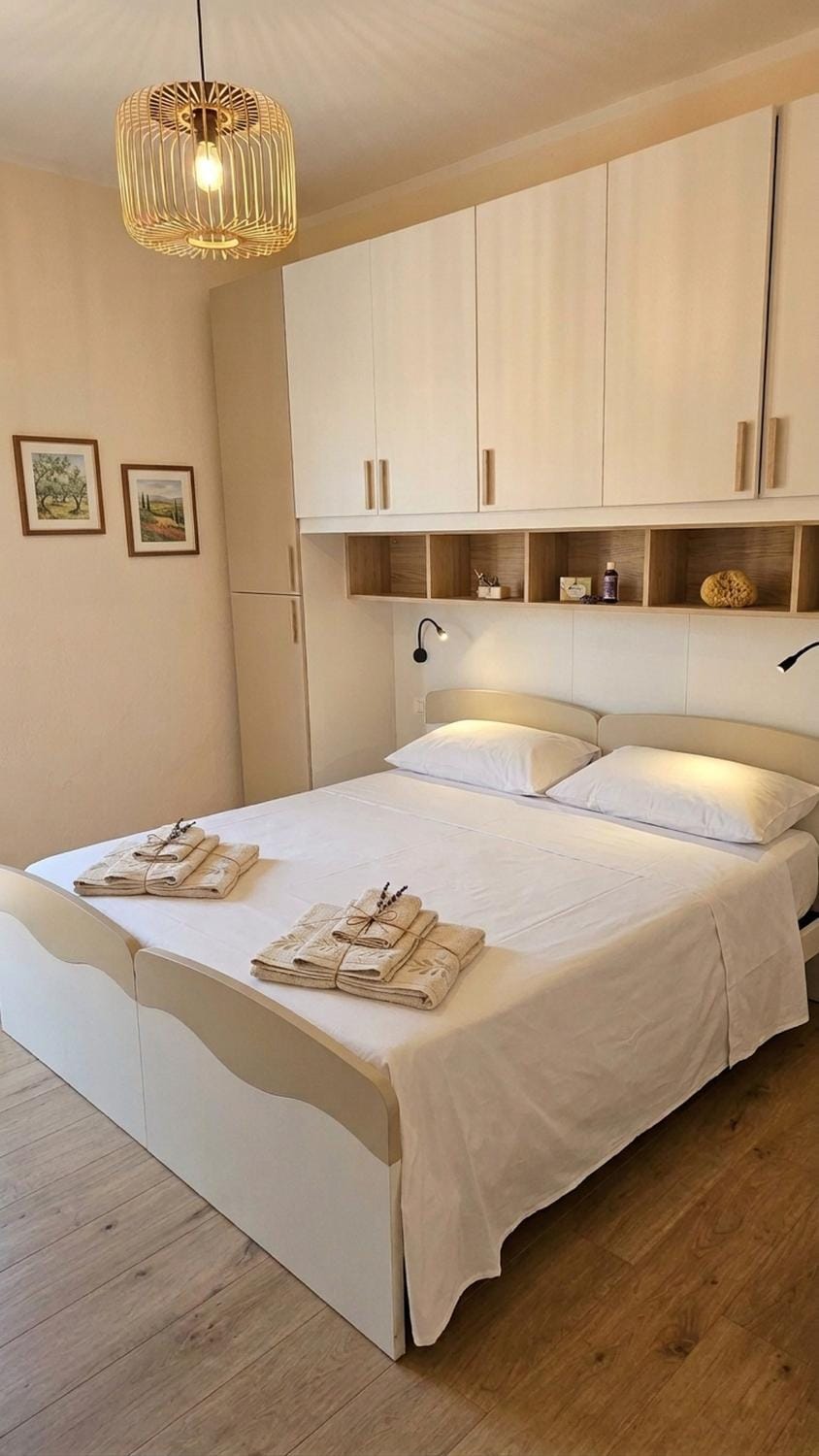 Bed, Photo of the whole room, Bedroom, hair dryier, towels, wardrobe
