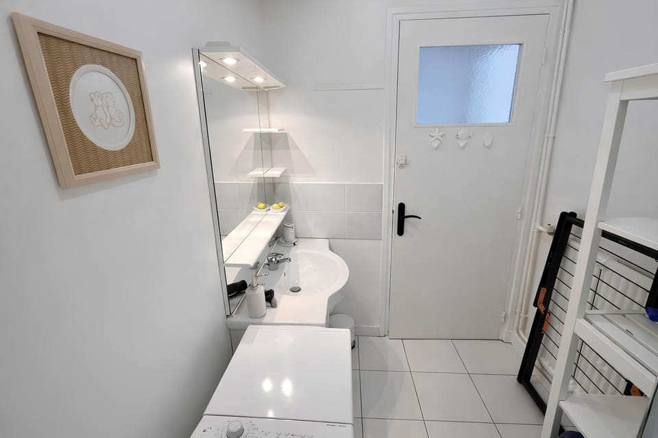 Shower, Toilet, Bathroom, hair dryier, towels, washing machine, washing machine