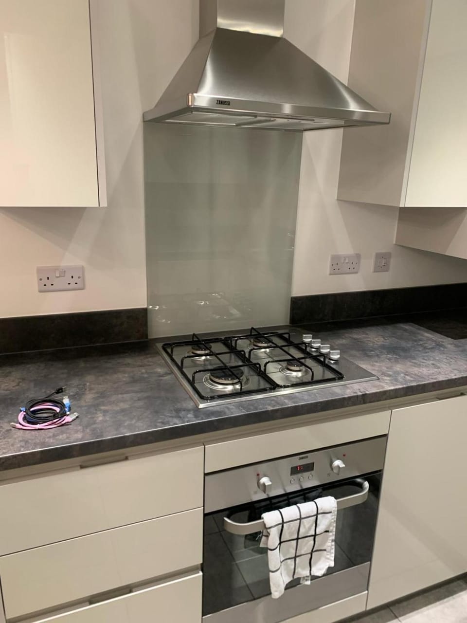 Kitchen or kitchenette, furniture, oven, stove, towels
