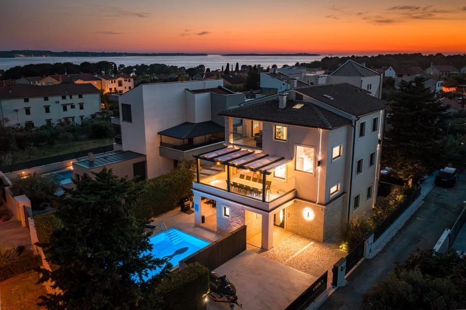 Property building, Patio, Night, Bird's eye view, Pool view, Sea view, Swimming pool, Sunset
