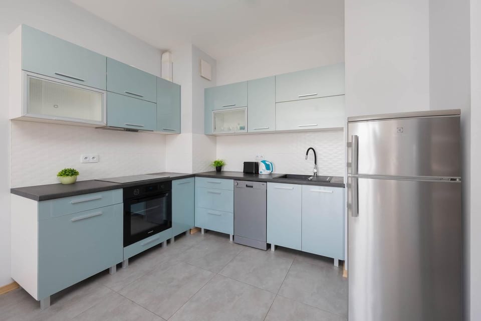 Kitchen or kitchenette, dishwasher, oven, stove