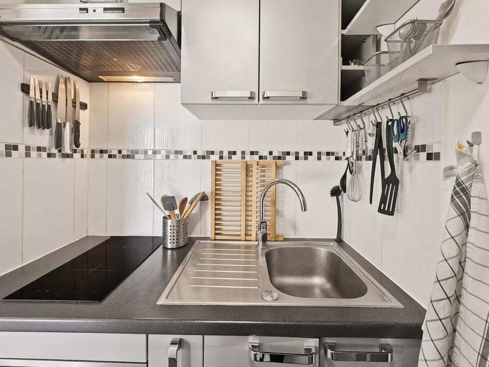 Kitchen or kitchenette, oven, storage, stove