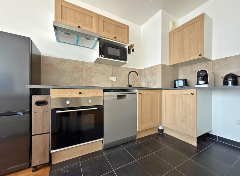 Kitchen or kitchenette, dishwasher, oven, stove, toaster