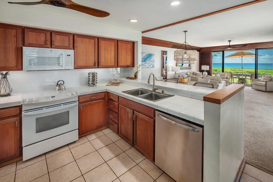 Kitchen or kitchenette, dishwasher, oven, stove
