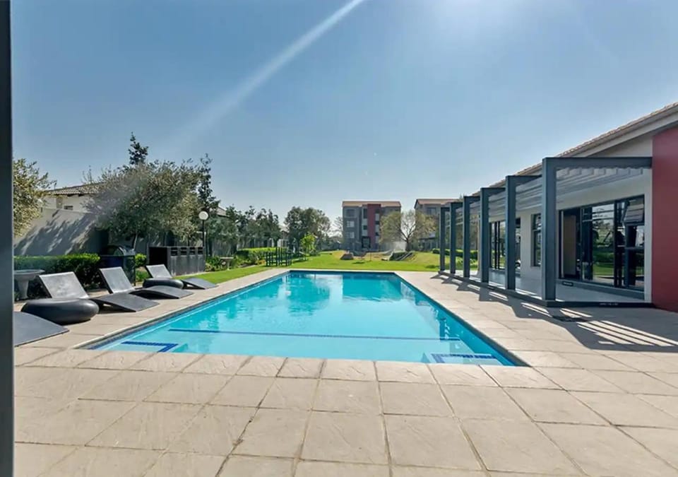Property building, Patio, Pool view, Swimming pool, sunbed