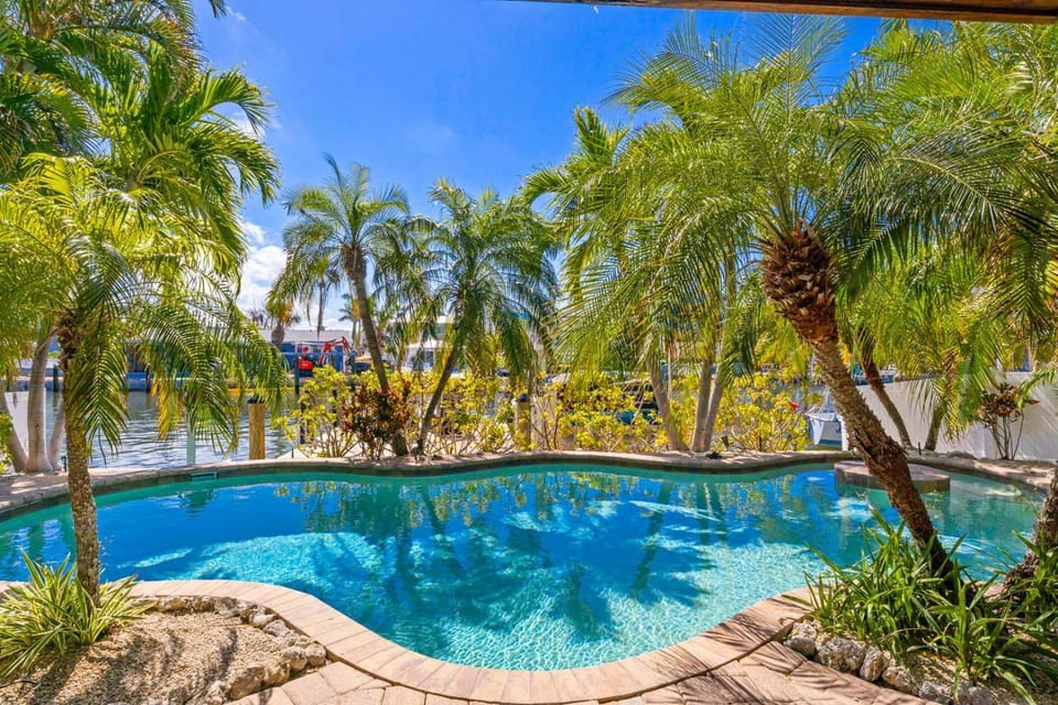 My Grand Floridian - Canal Front, Dock, Pool, Games by Anna Maria Life Vacation Rentals House in Holmes Beach