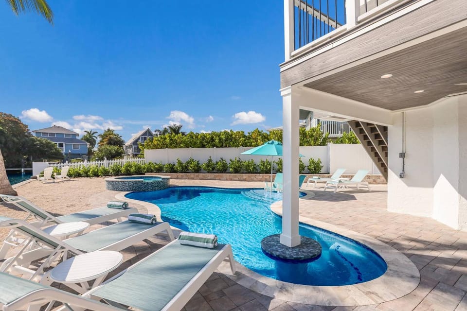 Playing Hooky - On Canal, Dock, Pool & Spa, Game Room by Anna Maria Life Vacation Rentals House in Anna Maria Island