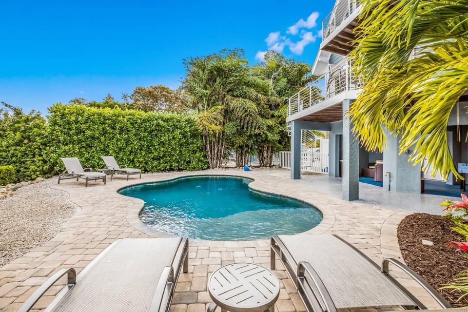 Soulshine - Dog Friendly! Pool, On a Canal with Dock by Anna Maria Life Vacation Rentals House in Anna Maria Island