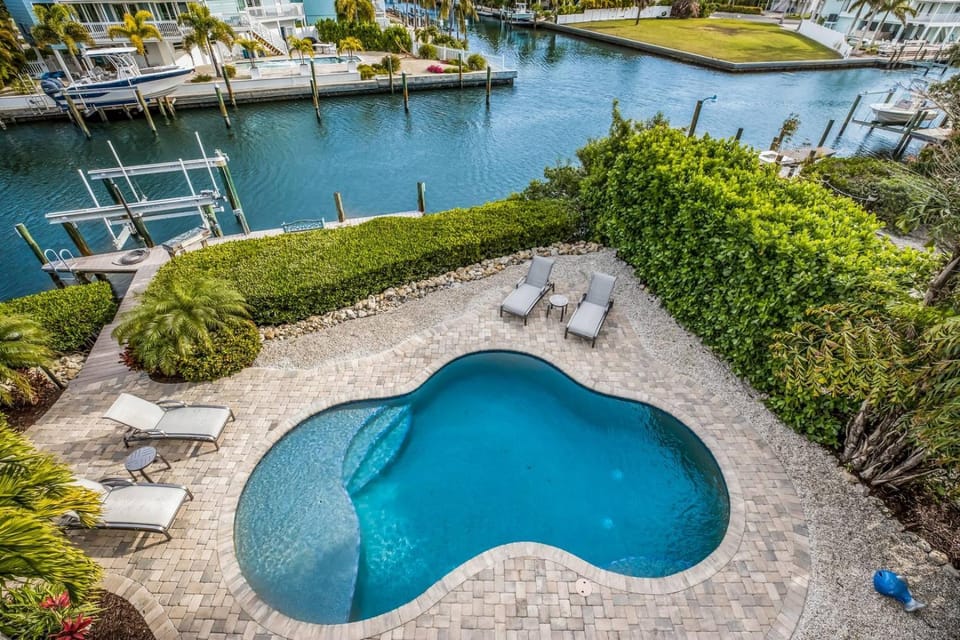 Soulshine - Dog Friendly! Pool, On a Canal with Dock by Anna Maria Life Vacation Rentals House in Anna Maria Island