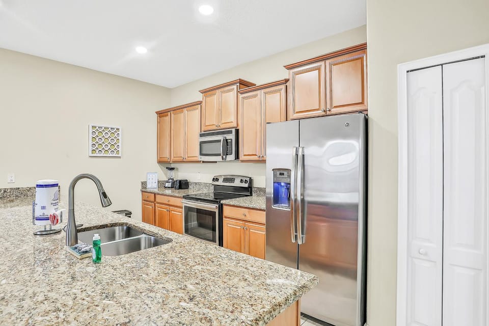 Kitchen or kitchenette, dishwasher, oven, stove, toaster