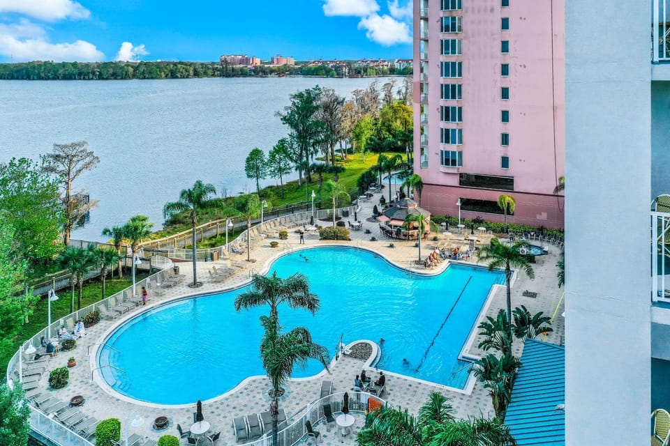 Property building, Day, Natural landscape, Pool view, Swimming pool, Swimming pool, sunbed