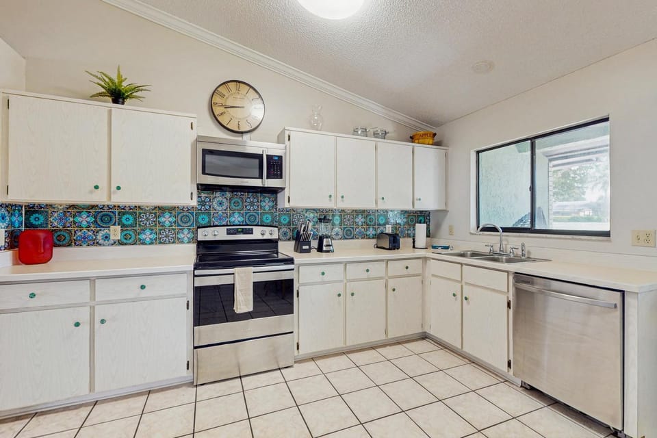 Kitchen or kitchenette, dishwasher, oven, stove, toaster