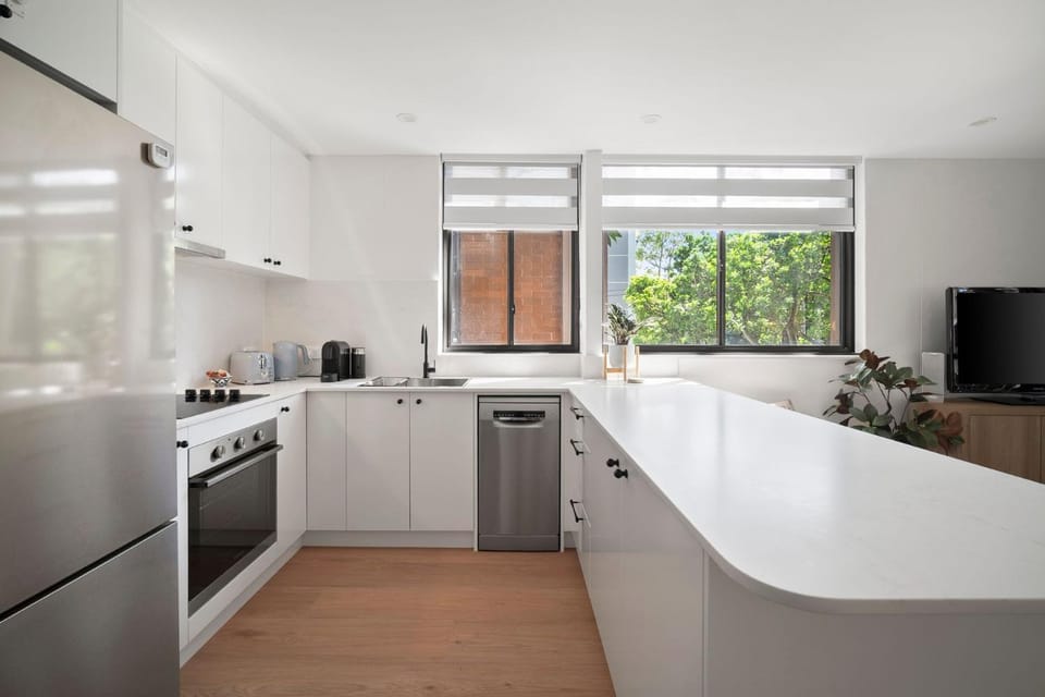 Kitchen or kitchenette, dishwasher, oven, stove