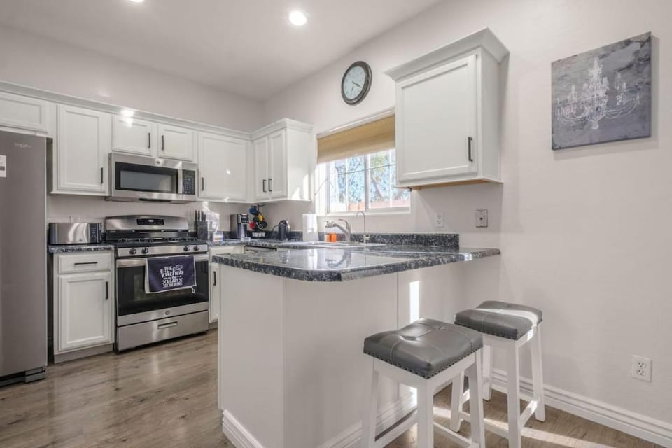 Kitchen or kitchenette, dishwasher, oven, stove, toaster
