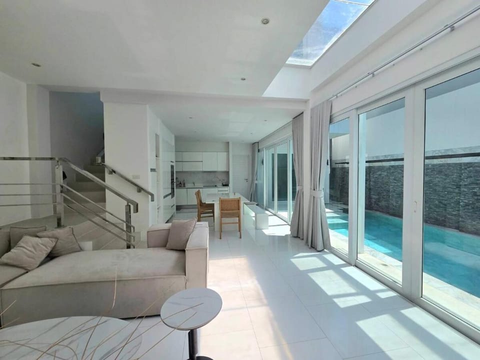 Living room, Seating area, Pool view