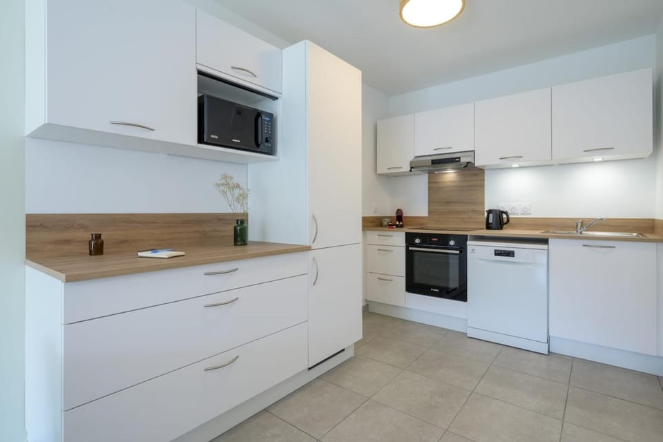 Kitchen or kitchenette, dishwasher, oven, stove, toaster