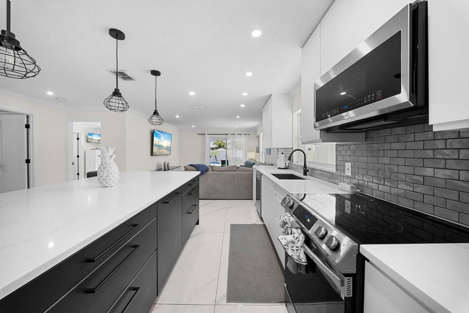 Kitchen or kitchenette, dishwasher, oven, stove