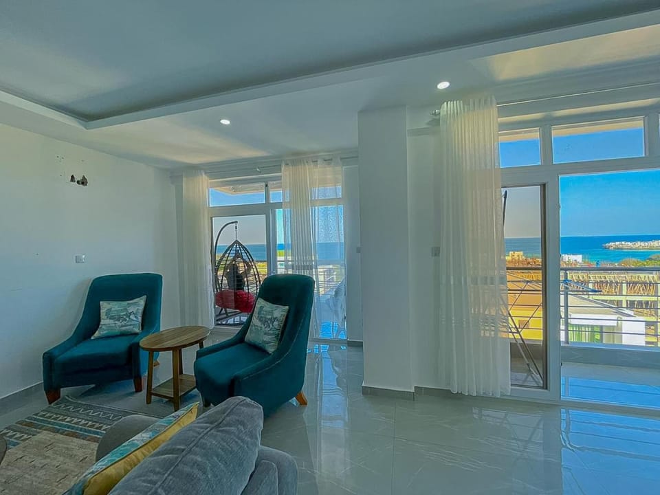 Natural landscape, View (from property/room), Living room, Seating area, Sea view
