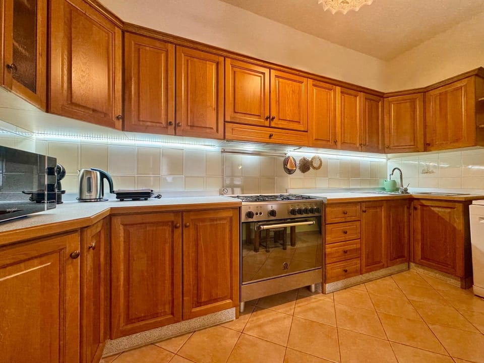Kitchen or kitchenette, dishwasher, oven, stove, toaster