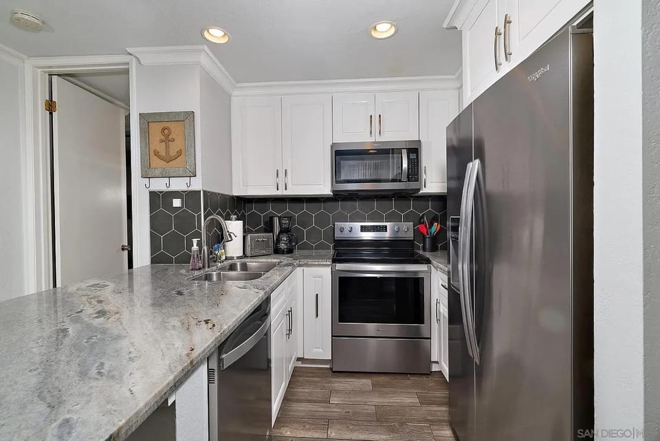 Kitchen or kitchenette, dishwasher, oven, stove, toaster