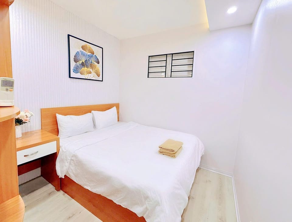 Bed, towels, wardrobe