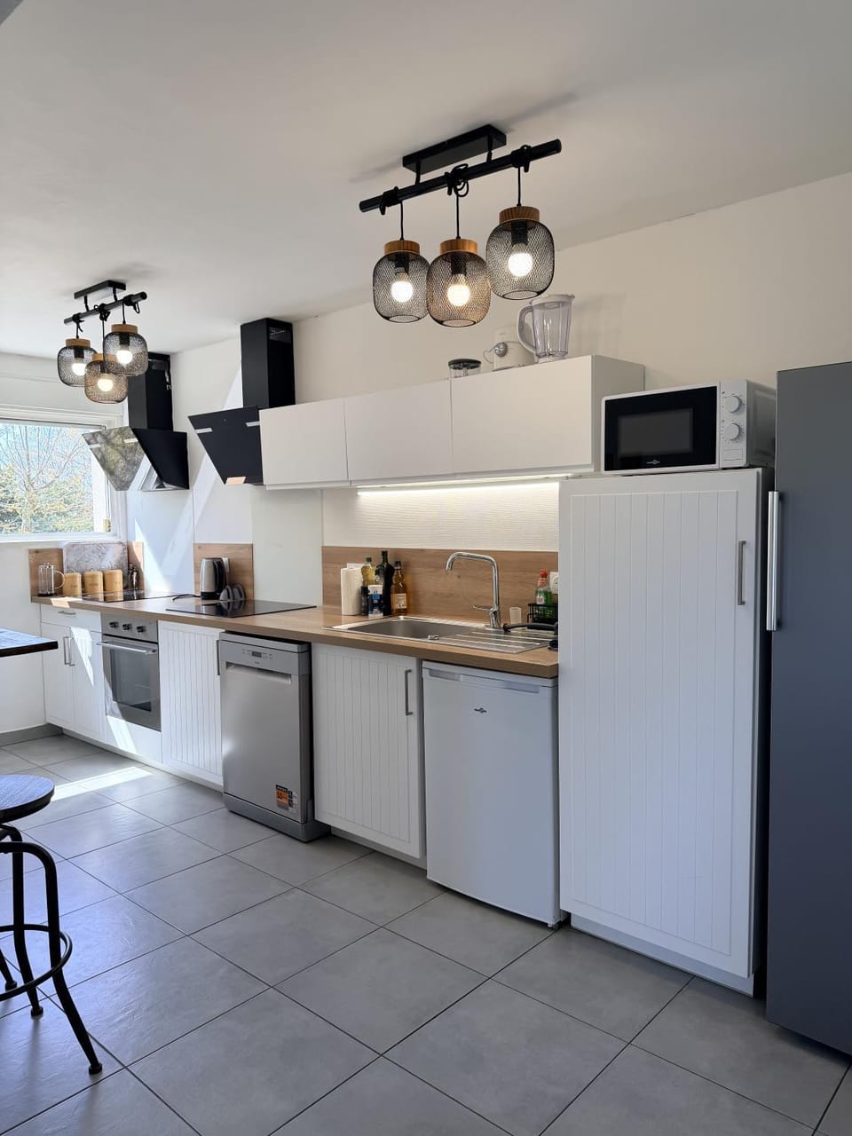 Kitchen or kitchenette, dishwasher, oven, stove