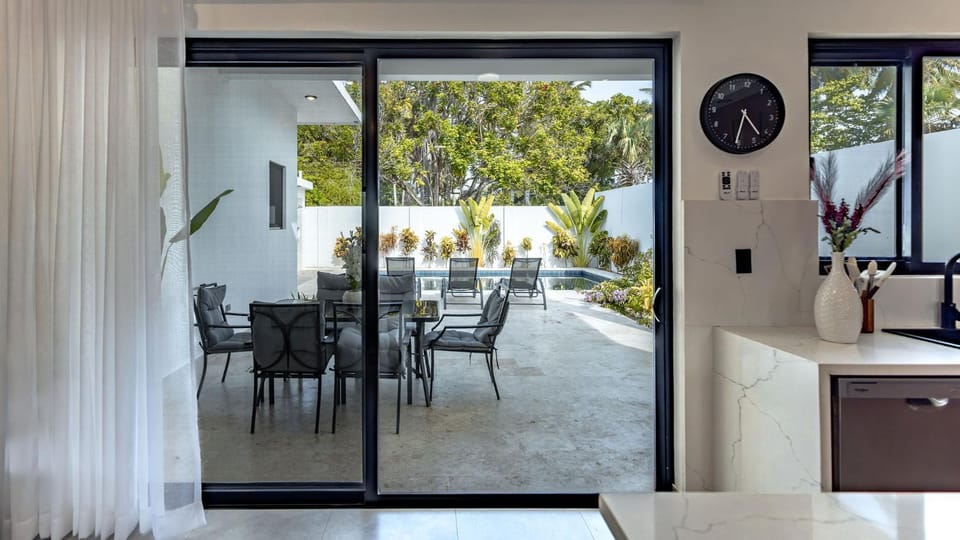 Patio, Living room, Seating area, Dining area, Swimming pool