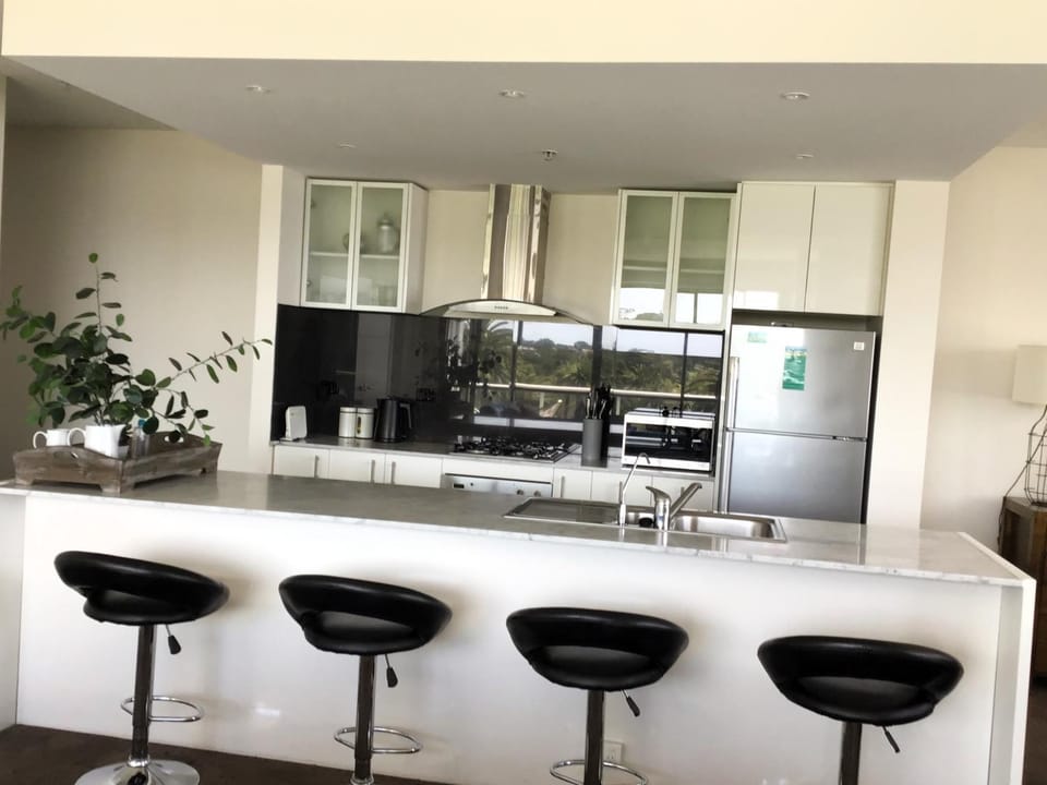 Kitchen or kitchenette, microwave, oven, stove