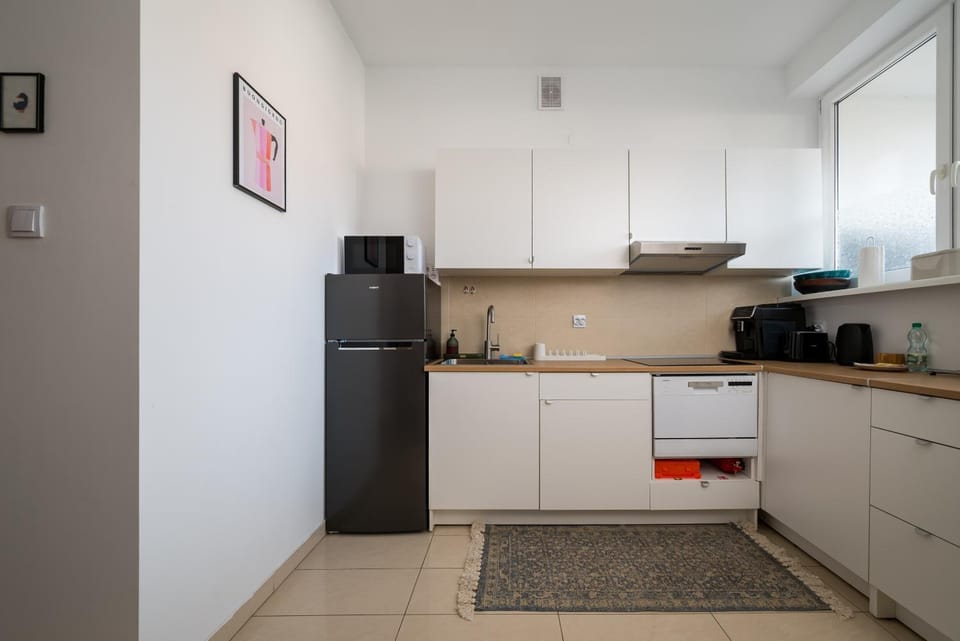 Kitchen or kitchenette, dishwasher, oven, stove