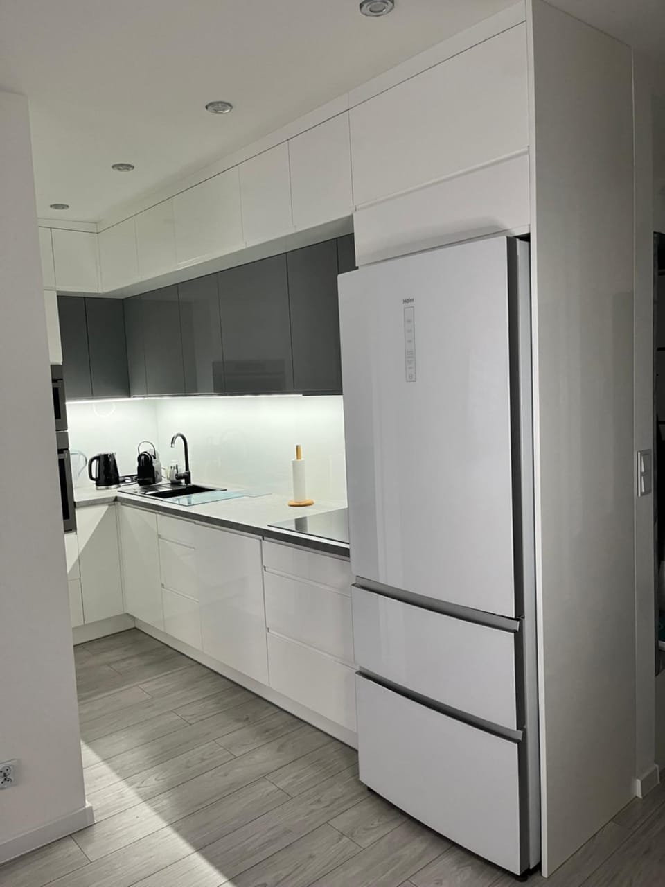 Kitchen or kitchenette, dishwasher, oven, stove