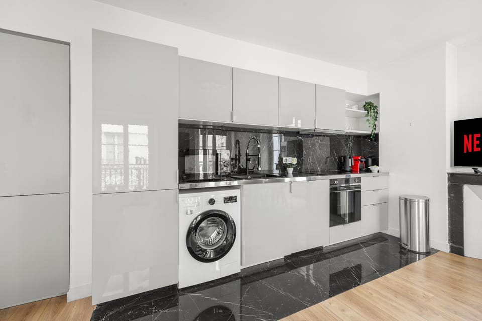 Kitchen or kitchenette, oven, stove, toaster, washing machine