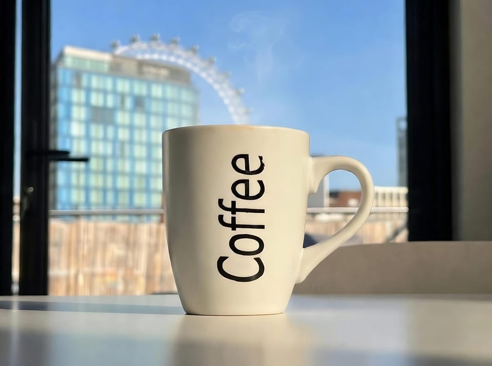 Coffee/tea facilities, Kitchen or kitchenette, Text overlay, Landmark view