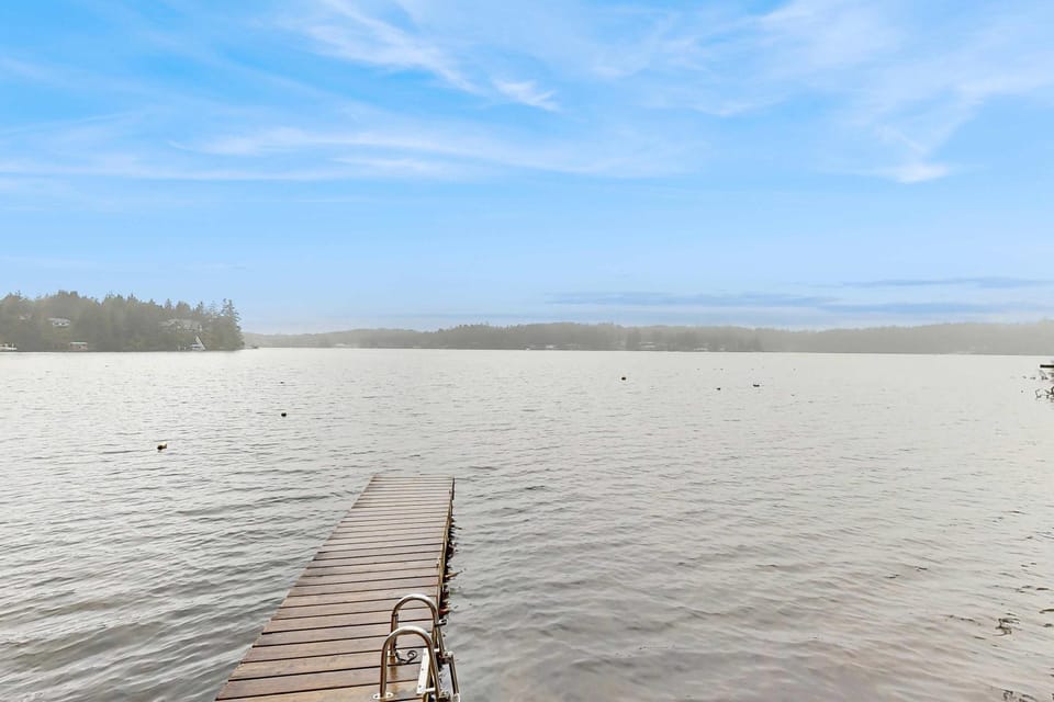 Lakefront dream with private hot tub dock kayaks pedal boat & amazing views House in Dunes City