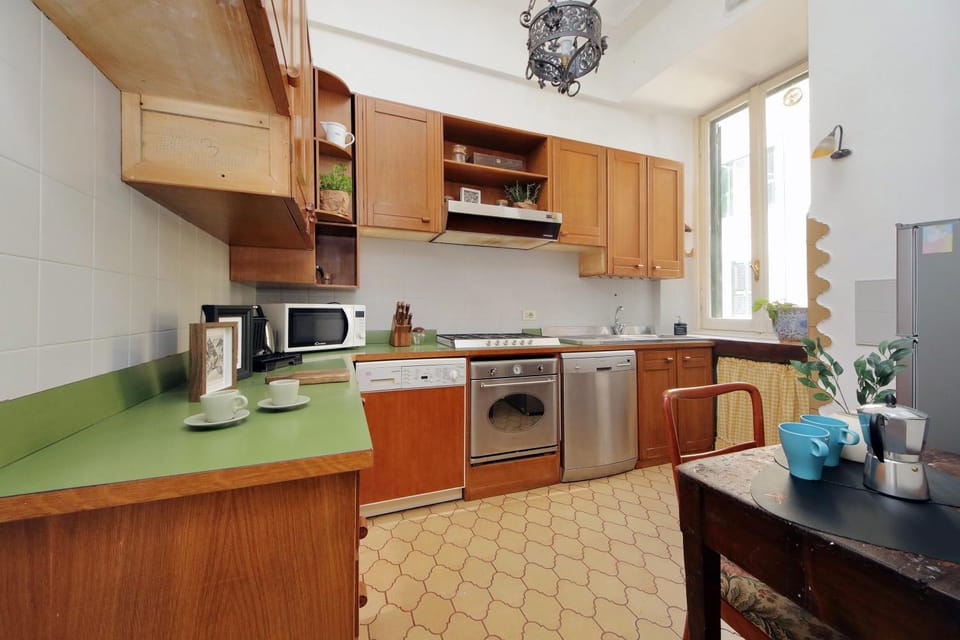 Kitchen or kitchenette, dishwasher, oven, stove, toaster, washing machine