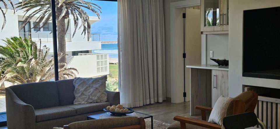 Natural landscape, View (from property/room), Living room, Seating area, Sea view