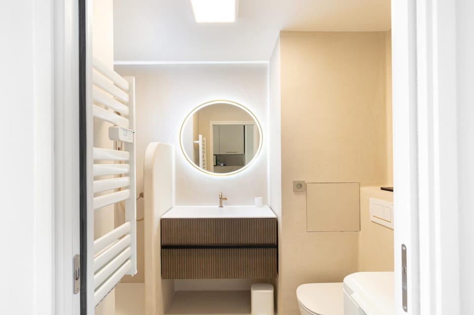Toilet, Bathroom, hair dryier, towels