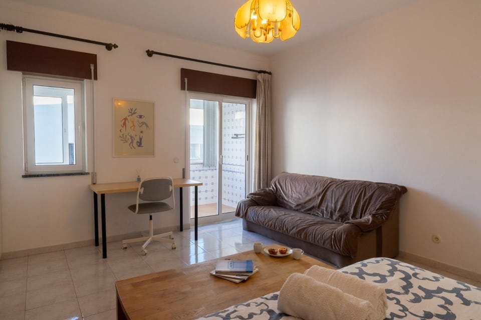 Large room with private lounge area, work space and balcony Vacation rental in Lagos