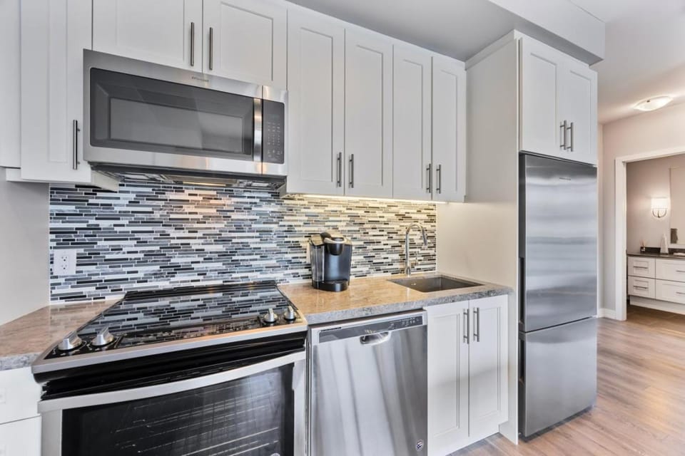Kitchen or kitchenette, dishwasher, oven, stove, toaster
