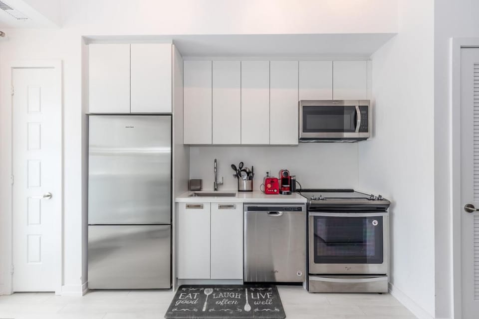 Kitchen or kitchenette, dishwasher, oven, stove, toaster, washing machine, dryer
