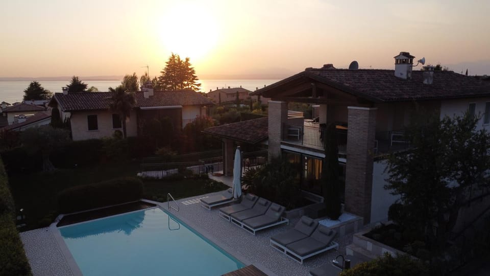 Property building, Natural landscape, Pool view, Sunset