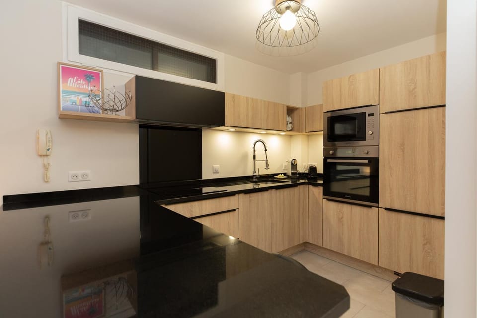 Kitchen or kitchenette, dishwasher, oven, stove