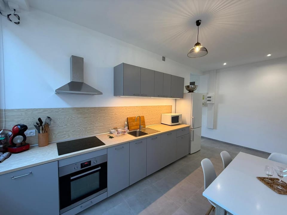 Dining area, dishwasher, microwave, oven, stove, toaster, kitchen