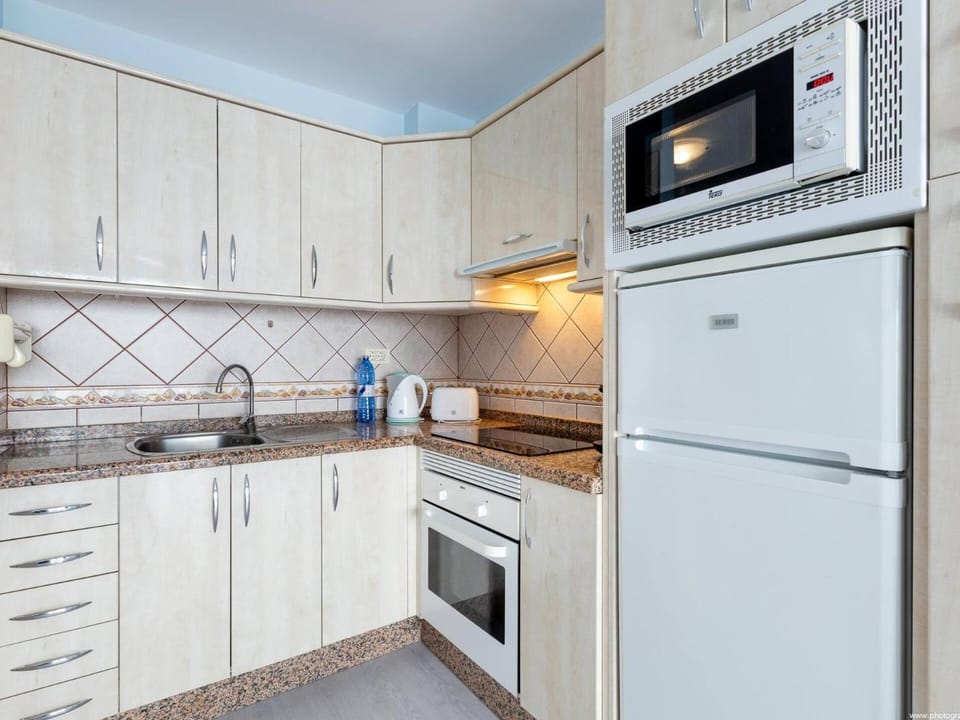 Kitchen or kitchenette, oven, stove, toaster