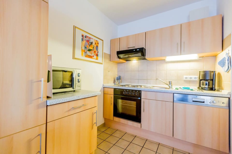 Kitchen or kitchenette, dishwasher, oven, stove, toaster