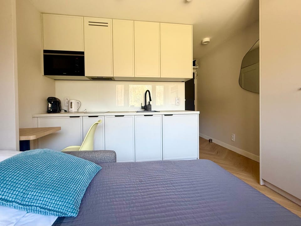 Bed, Kitchen or kitchenette, microwave, oven, stove, kitchen